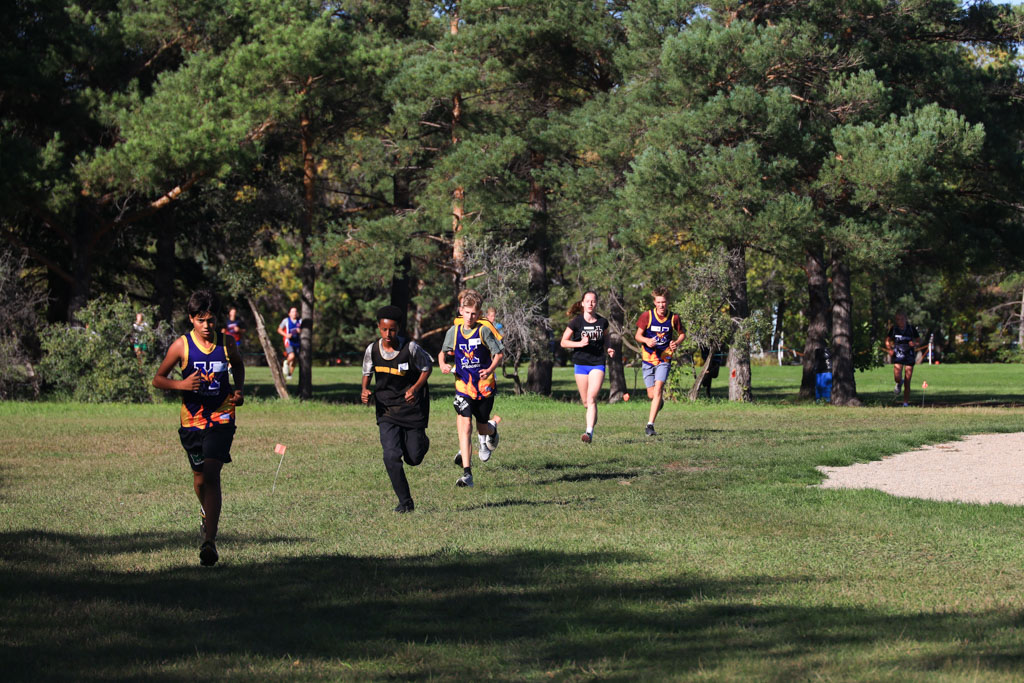 Cross Country runners head towards the camera