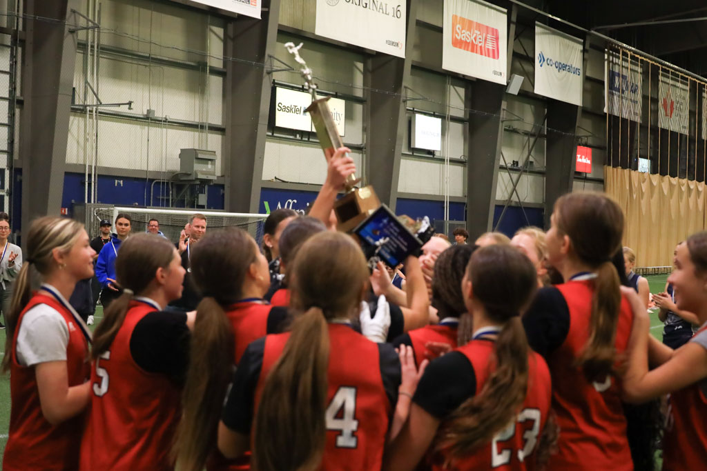 St Elizabeth Girls Football Team hold the trophy